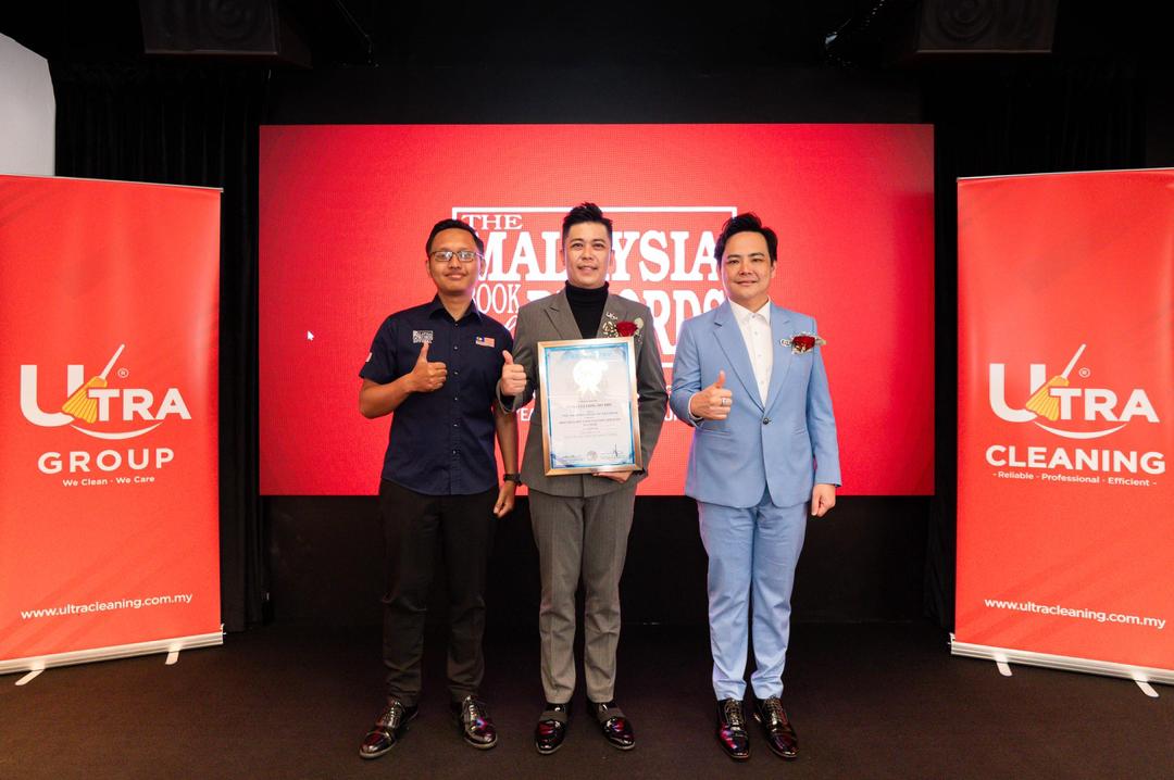 Ultra Cleaning founders receiving The Malaysia Book of Records award