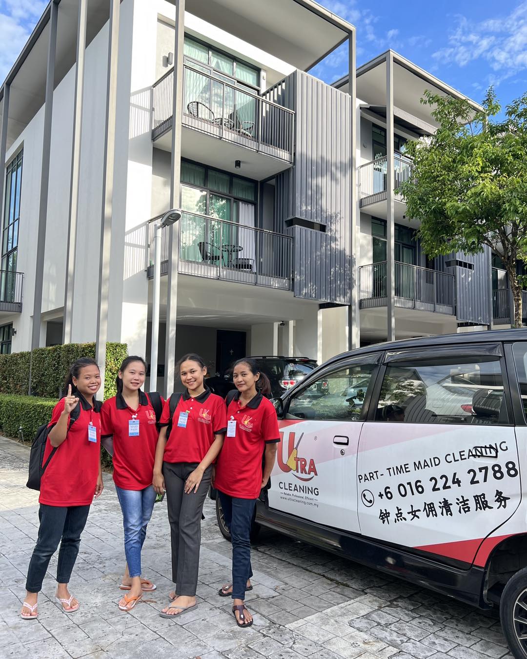Uniformed Ultra Cleaning specialists ready for an office cleaning session