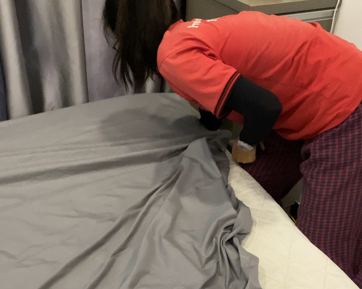 Ultra Cleaning specialist handling household linen and laundry