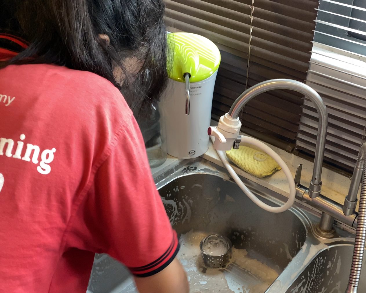 Ultra Cleaning specialist scrubbing a kitchen sink in Bangsar
