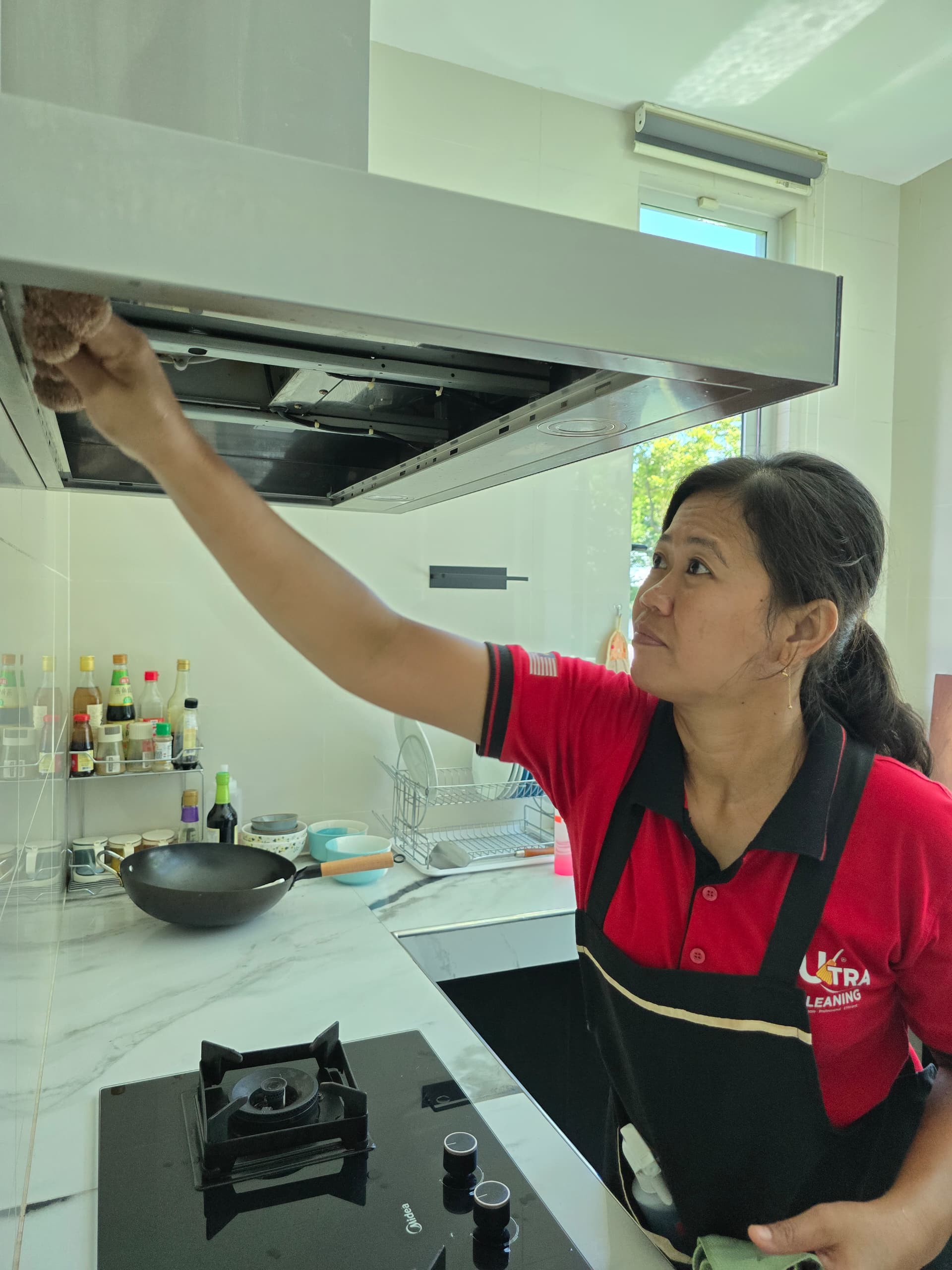Ultra Cleaning specialist degreasing a kitchen range hood